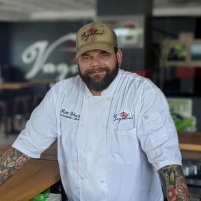 Chef wearing tan ball cap