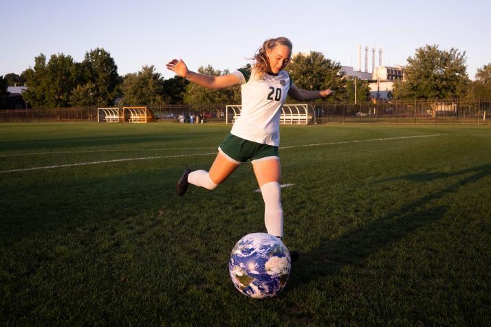 photo of Regan Berg with earth ball