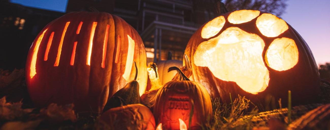 paw print and OHIO pumpkins at night at the Ridges