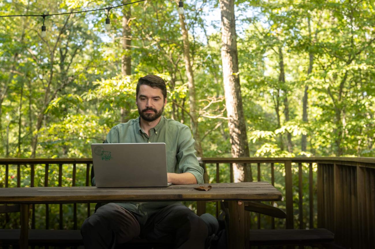 student working at laptop from home