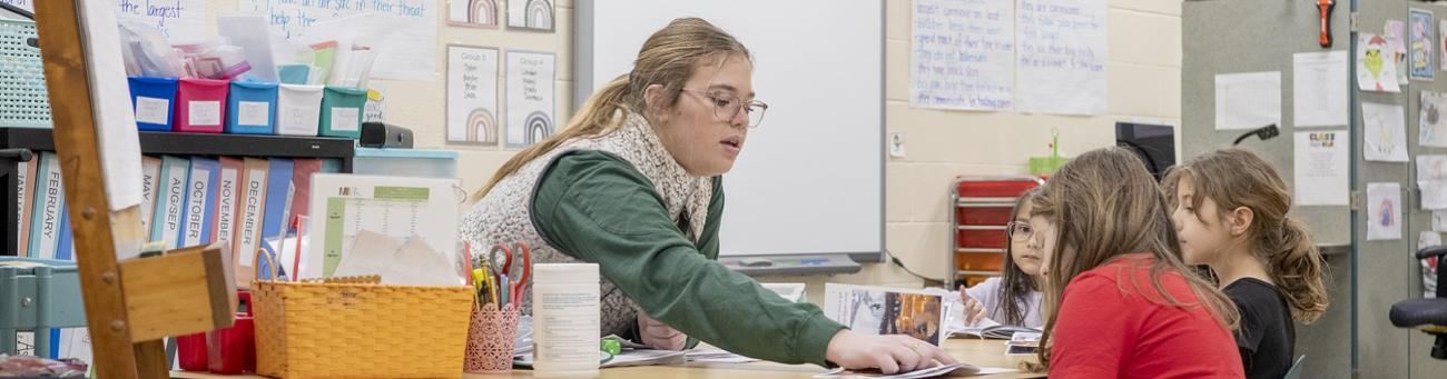 a student teaches children in a classroom