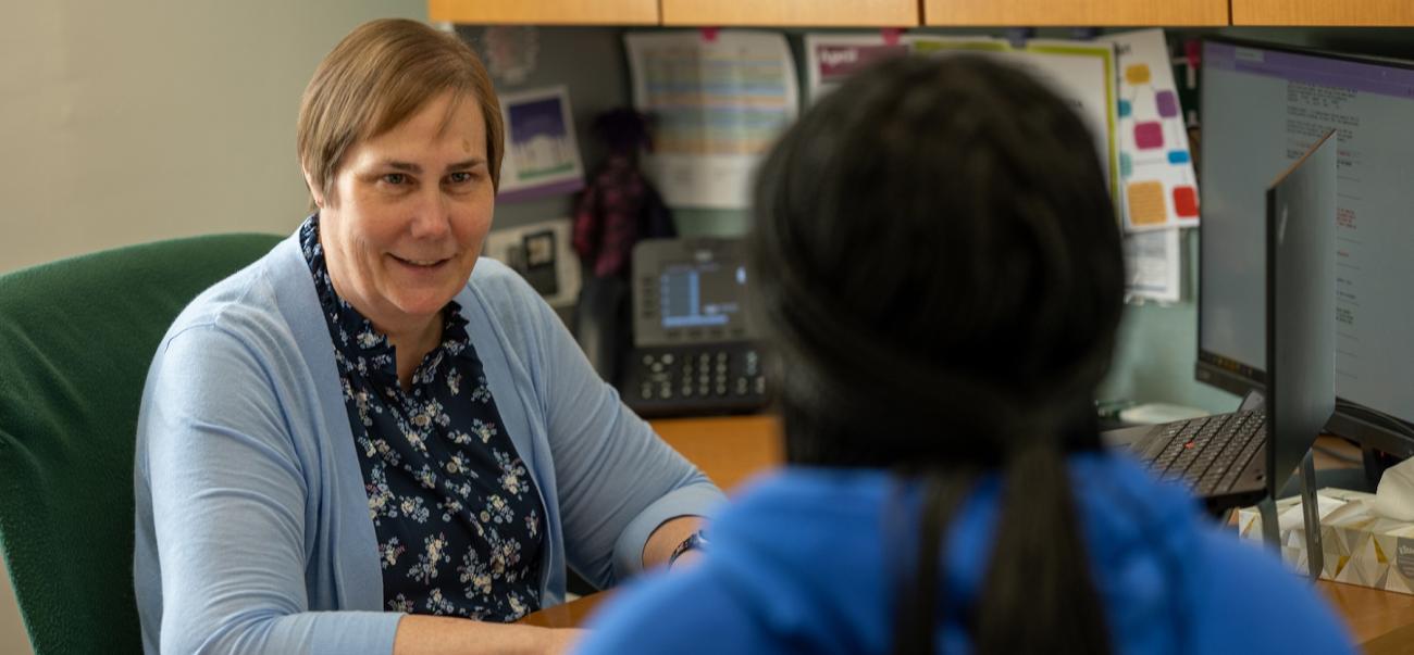 an advisor meets with a student