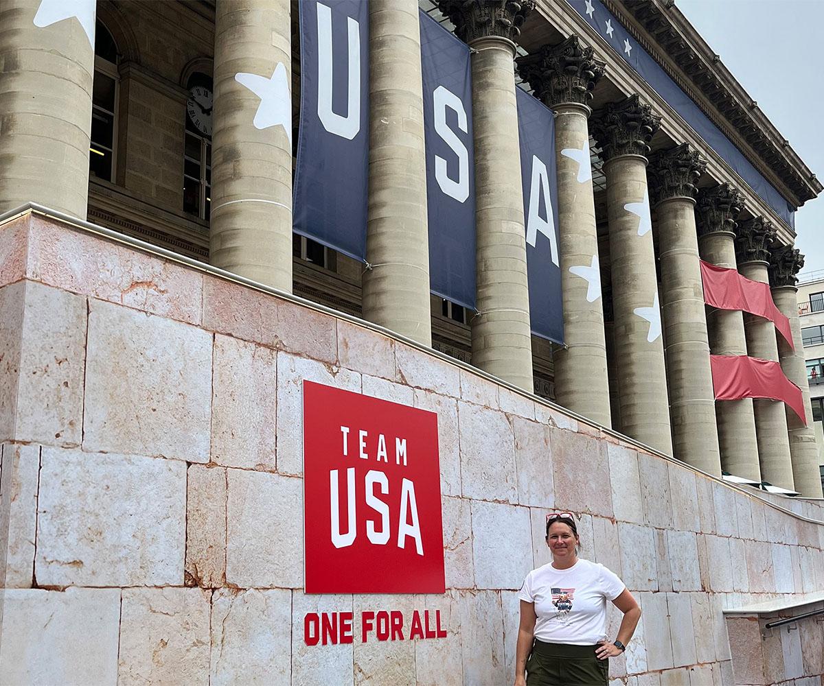 OHIO Alum Lisa Milne poses for a photo outside of the USA Team House.