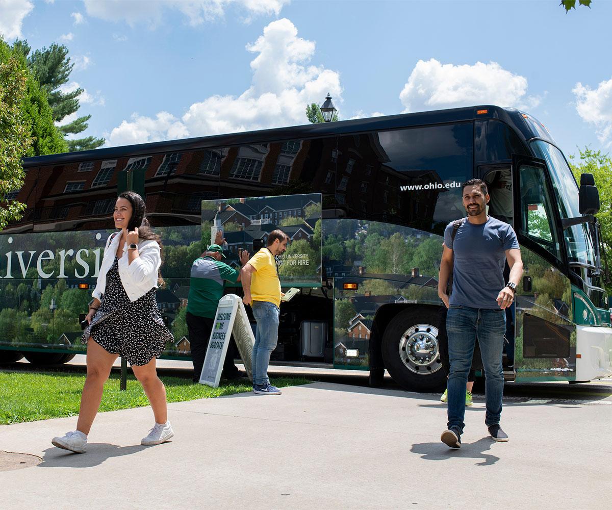 Students exit a bus.