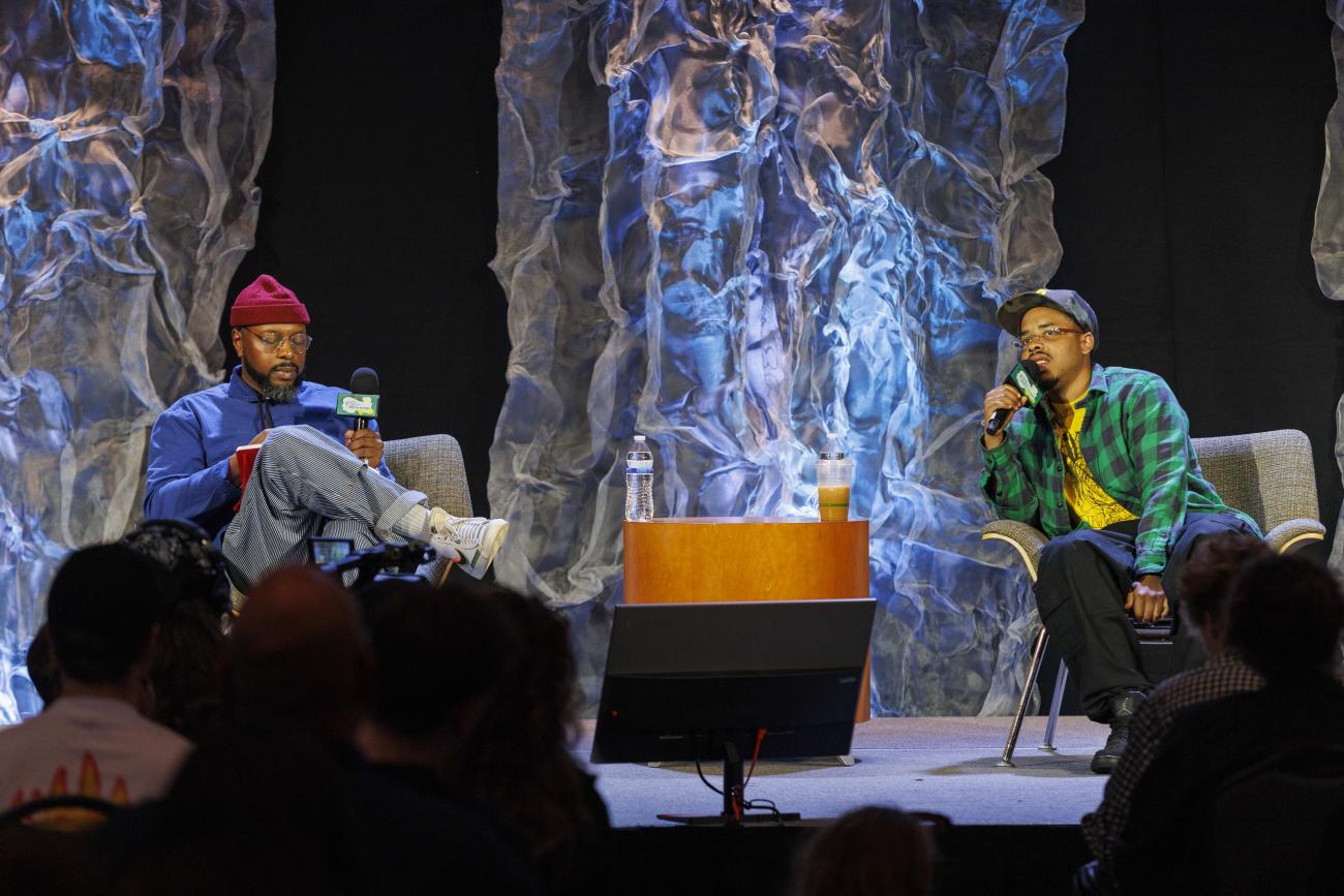 Earl Sweatshirt and Marcus J. Moore talking on stage