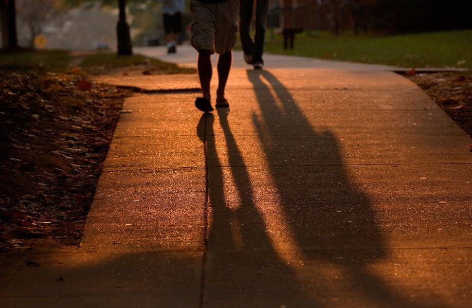 student walking on concrete