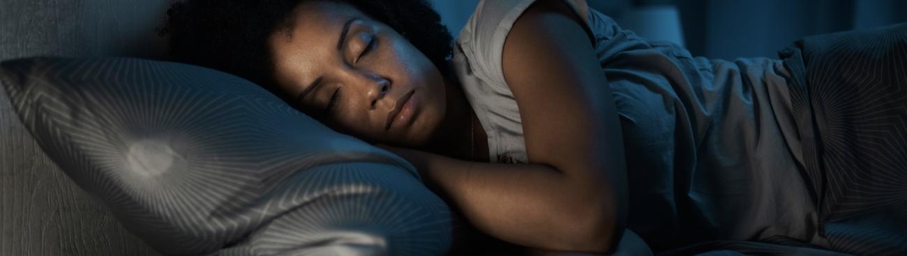 Woman asleep in bed.