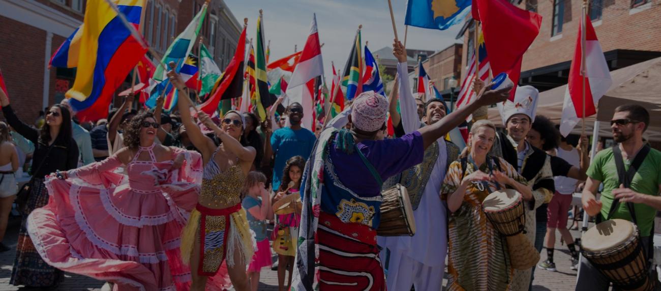 Participants dance and waive the flags of their nations during the annual International Street Fair 2015.