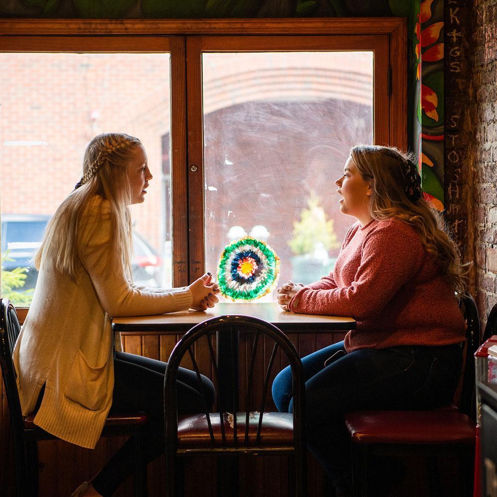 Students sit together at a restaurant