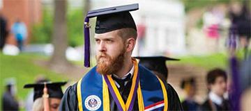 A student wearing graduation attire