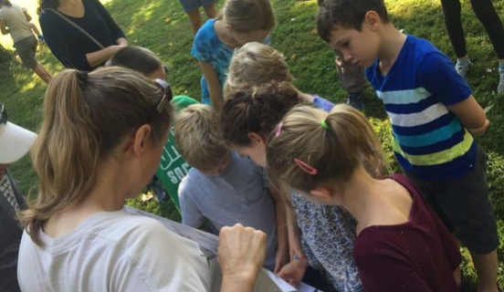 Children looking at a piece of paper