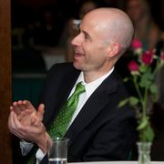 Man clapping at a banquet