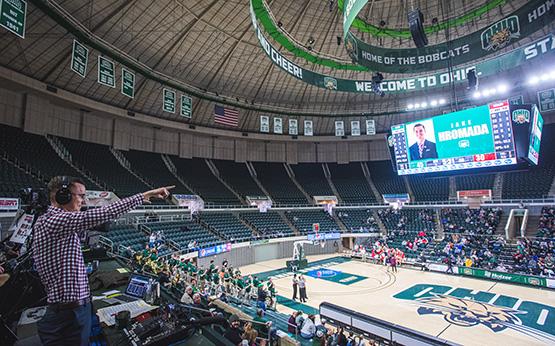 Students in the stands during an Ohio University basketball game.