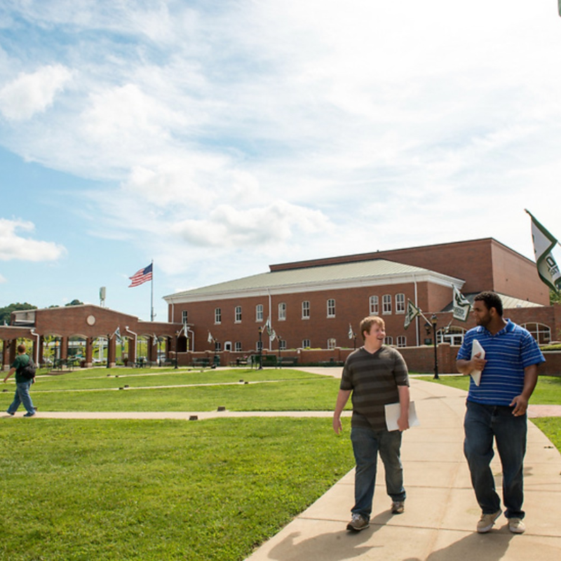 People walking and talking on campus