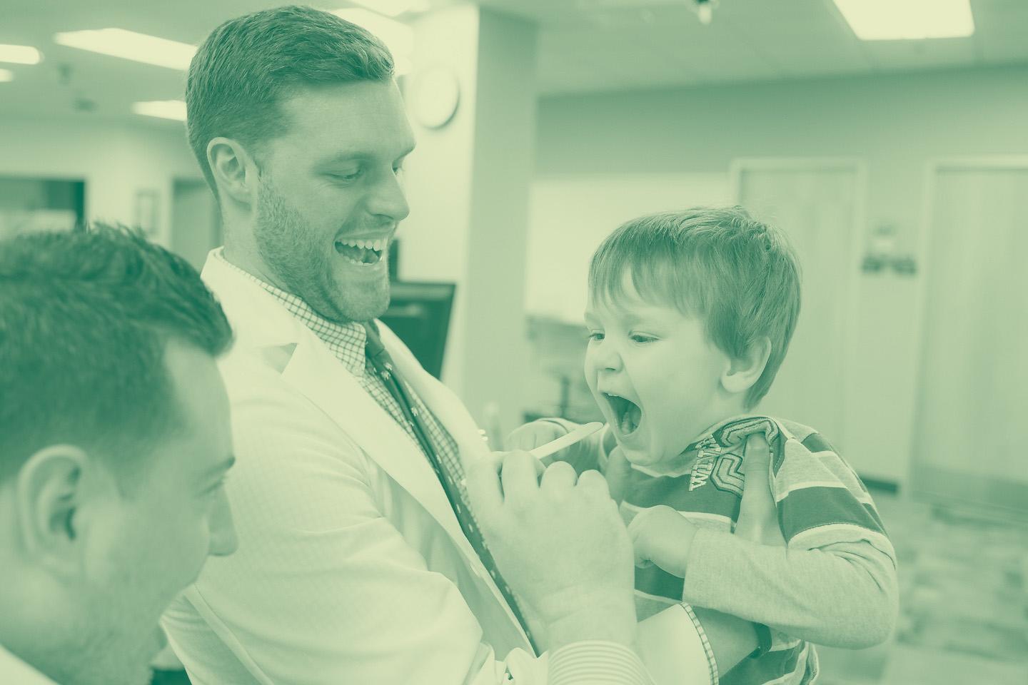 Medicine students work with boy patient