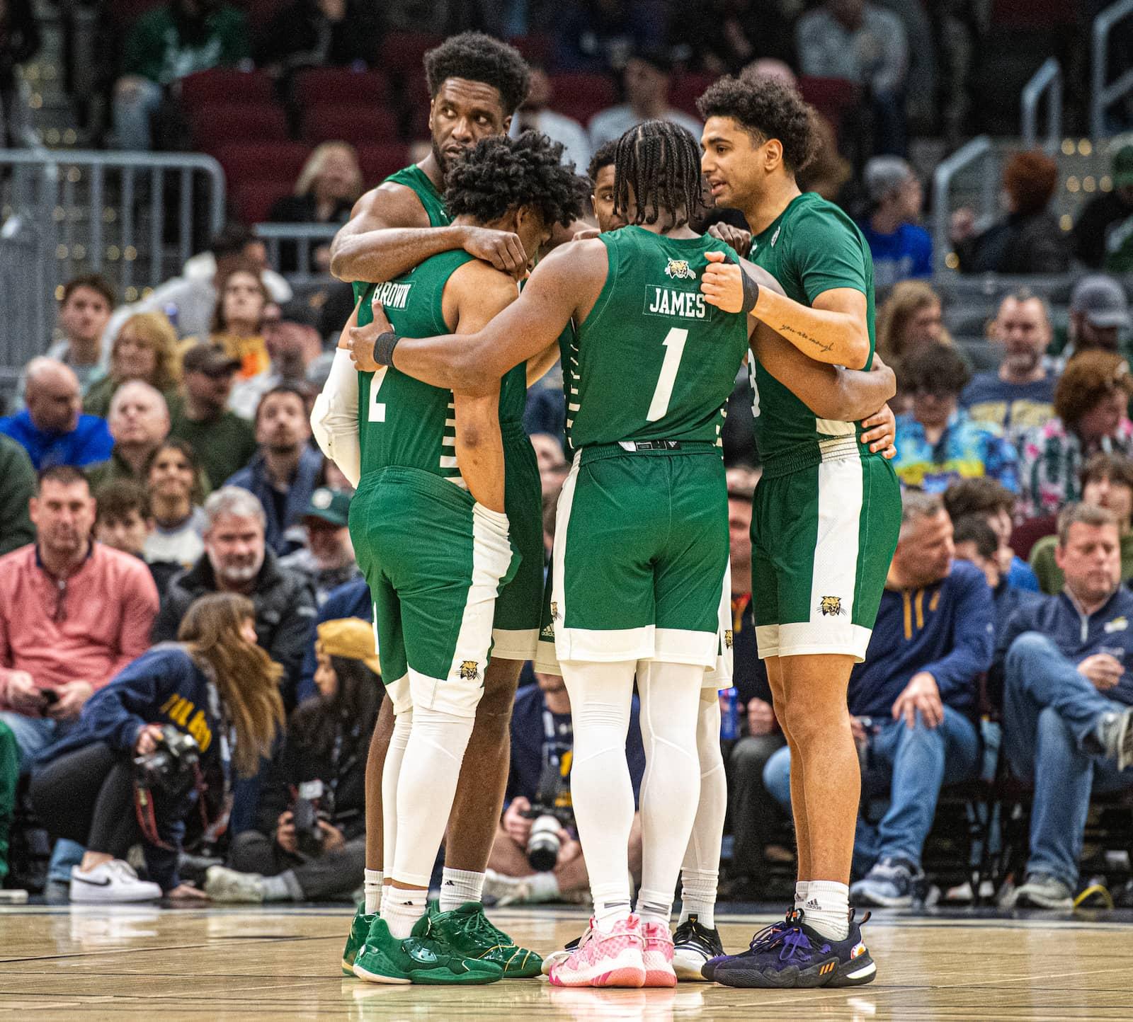 The Ohio starting five huddle arm-in-arm before their MAC Tournament semifinal game vs. No. 1 Toledo. 