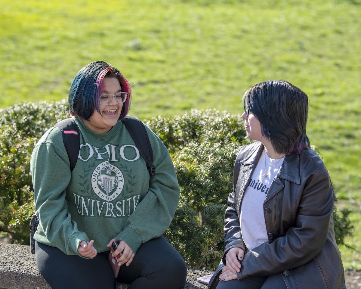 A LINKS student talks with a fellow student 