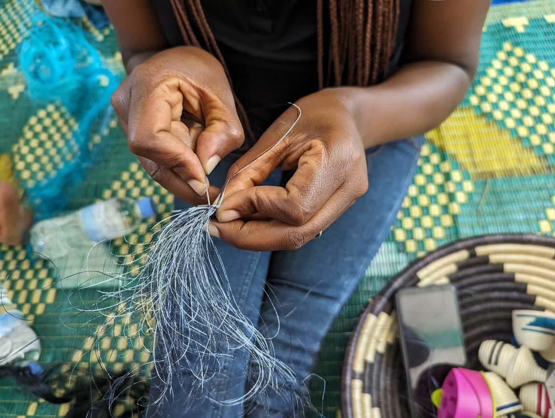 A weaver working with thread