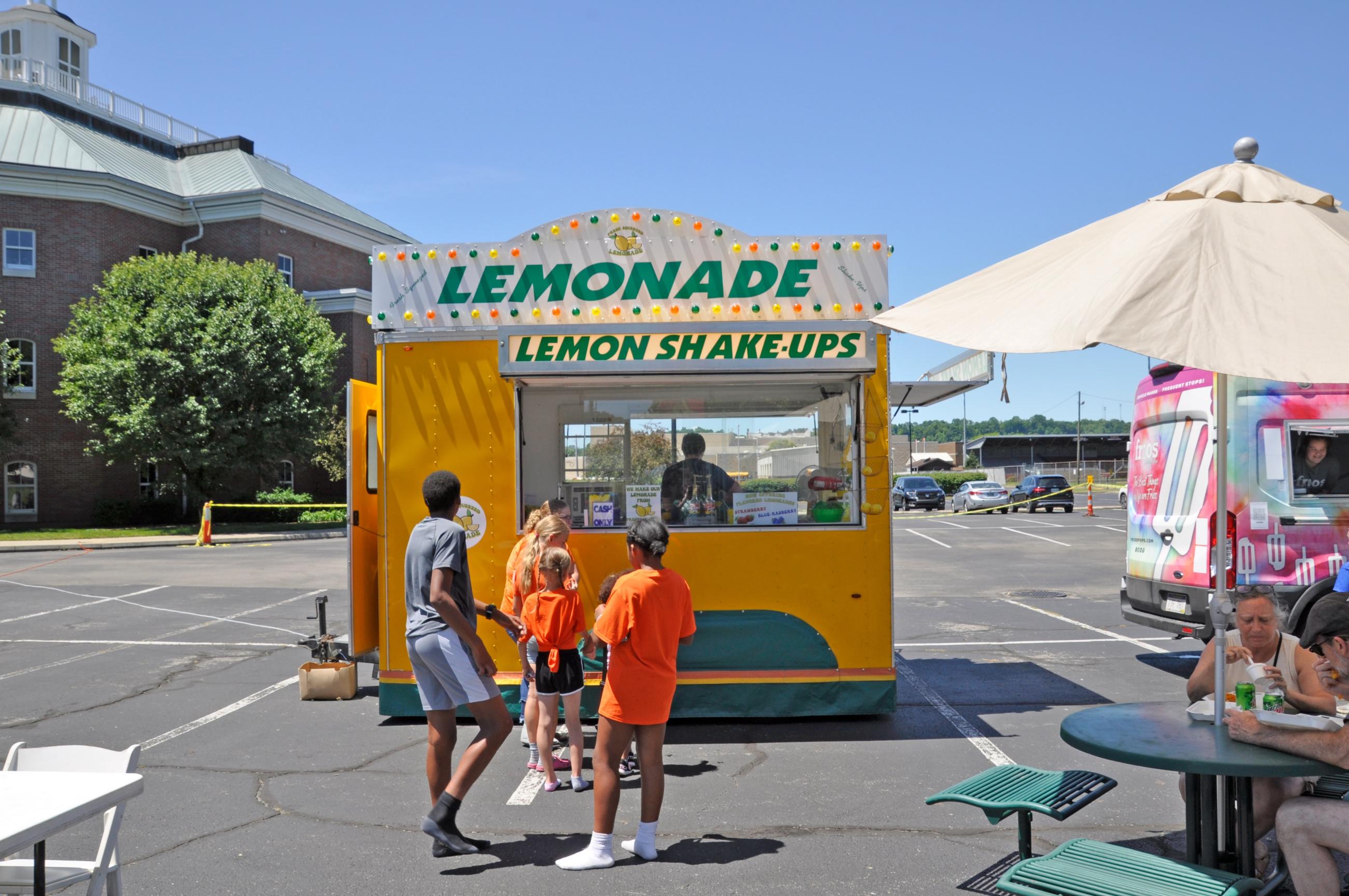 Youth stand in line for lemonade