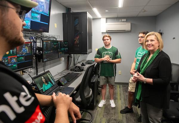 President Gonzalez talks with students in the Esports Arena.