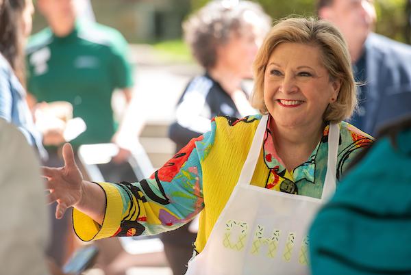 President Gonzalez serves ice cream at the ice cream social.