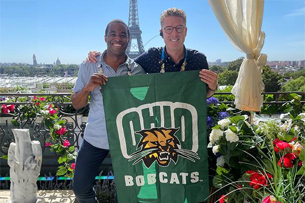 Alumni Matt Barnes and Michael Burns in front of the Eiffel Tower