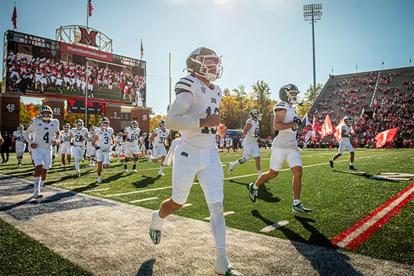 The Ohio football team runs onto the field at Miami’s Yager Stadium during the Battle of the Bricks on Saturday, October 19, 2024. 