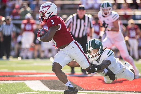 Ohio junior safety Adonis Williams dives at the feet of Miami running back Keyon Mozee. Williams was tied for a team-high four solo tackles in the game.