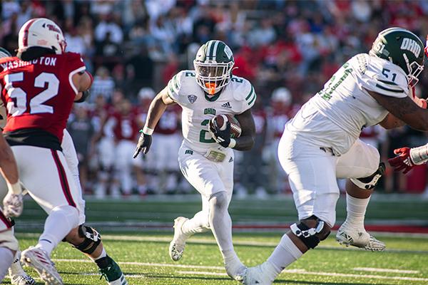 Ohio senior running back Anthony Tyus carries the ball against the Miami defense. Entering the game, Tyus led the MAC in rushing yards and total carries. 