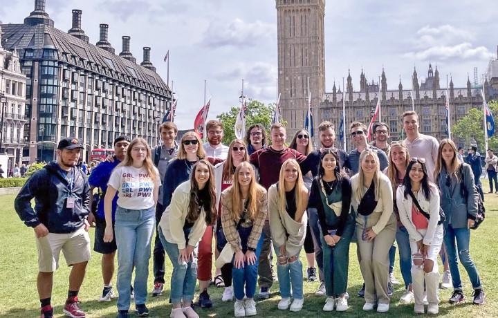 Group photo in front of buildings in Europe.