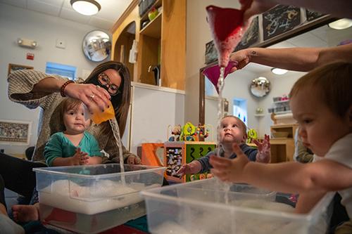 Patton College students work with children in a daycare during the COVID-19 pandemic.