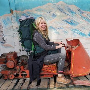 image of Dr. Rita on a sled with backpack