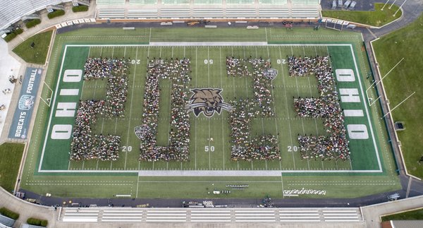 Students pose for a 2023 class photo at Peden Stadium. Photo by Ben Siegel