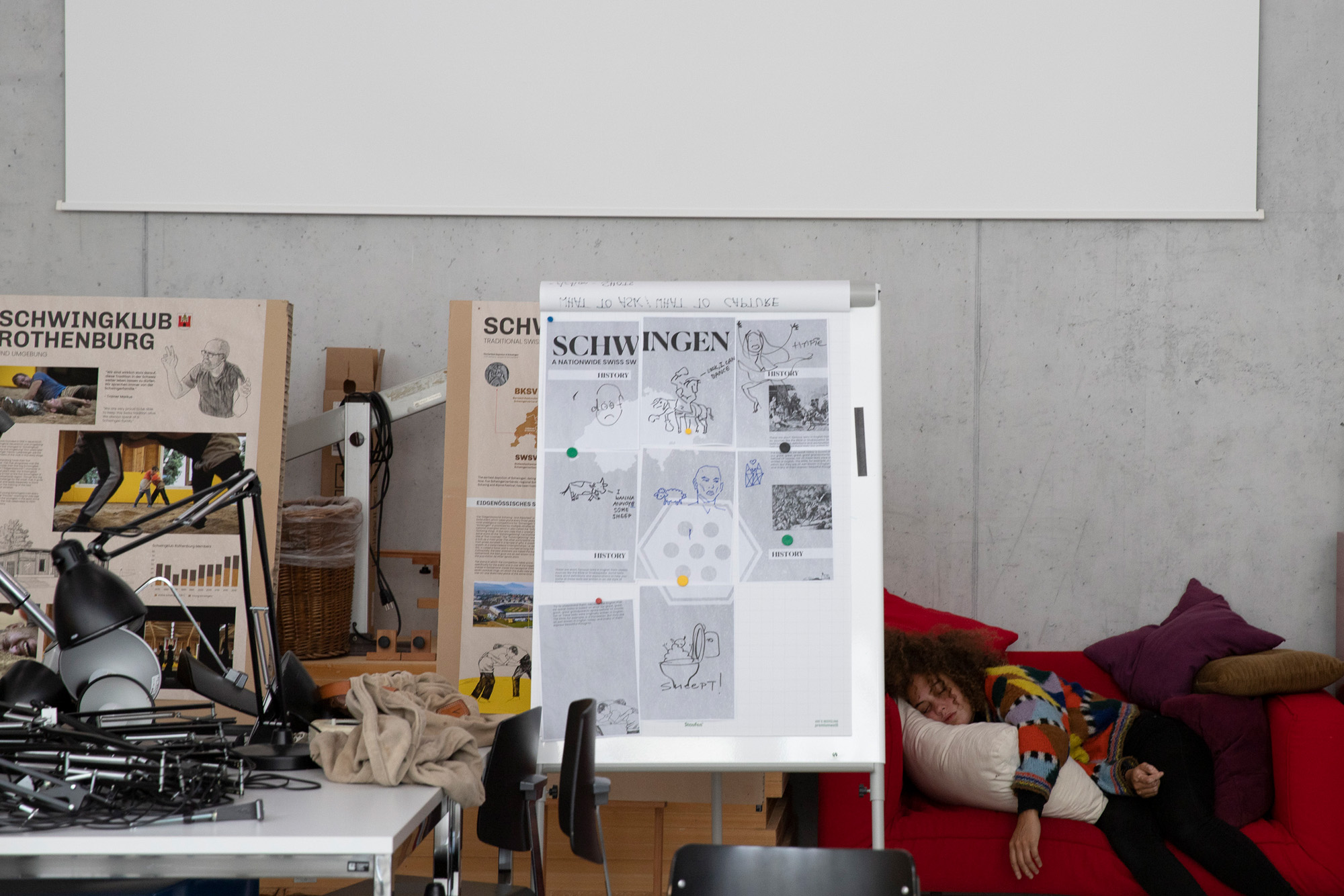 Xenia, a member of the Schwingen group, takes a nap during the final day of production at the conference on Sept. 16, 2022, in Lucerne, Switzerland.