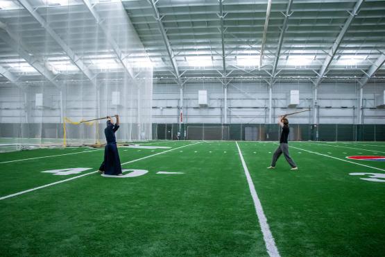 Kendo Club executive board members Jay Eungha Ryu, left, and Andrew Kasick, right, practice Kendo in Walter Fieldhouse.