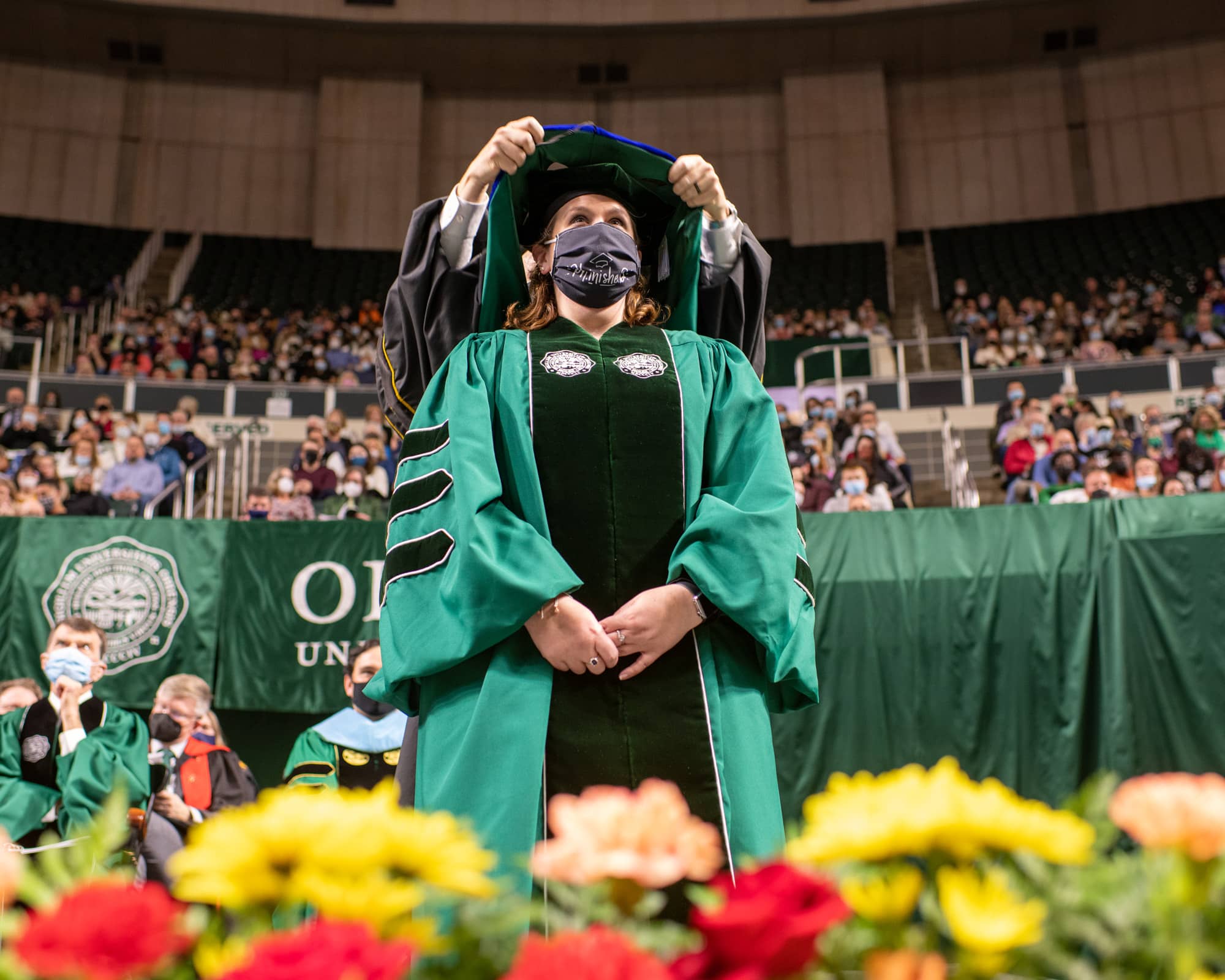 A graduate receives recognition during the Fall Commencement 2021 at the Athens Campus.