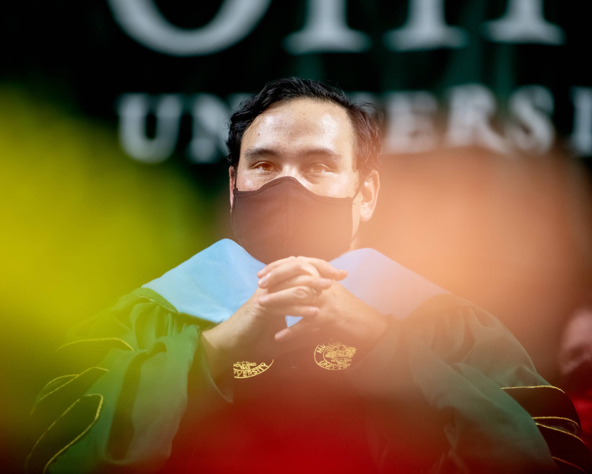 Ohio University Associate Professor David Nguyen waits to delivers the keynote address at Fall 2021 Commencement.