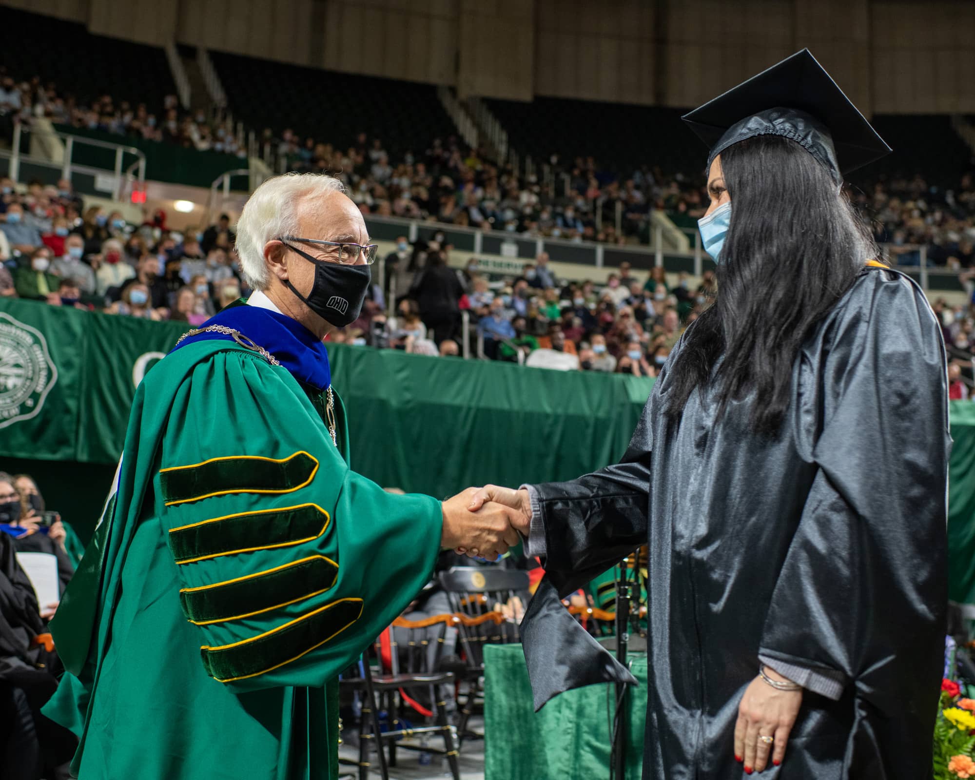 President Hugh Sherman congratulates a student during Fall Commencement 2021 at the Athens Campus.