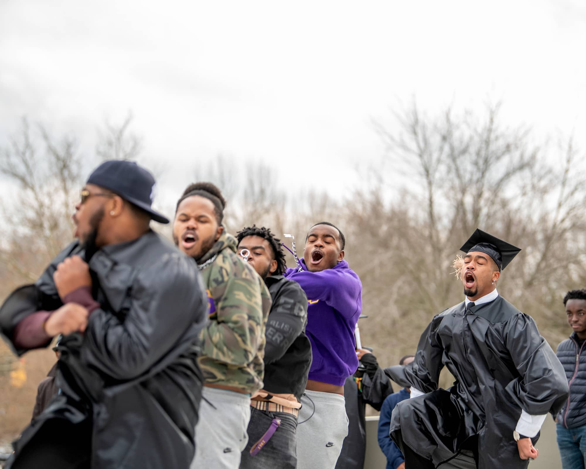 Fraternity members celebrate with one another after the Fall Commencement 2021 at the Athens Campus.