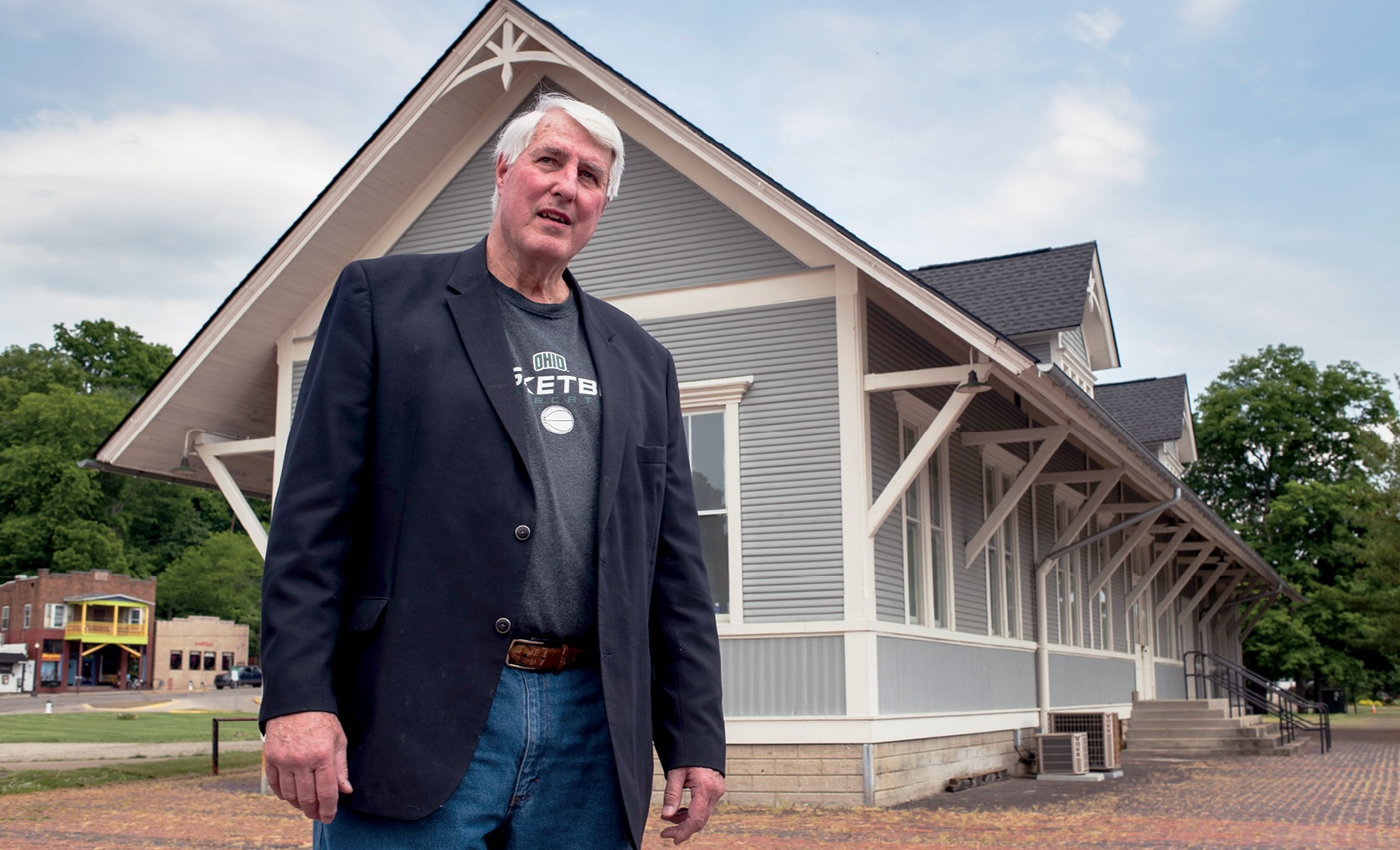 Gary Wolf stands in front of the Athens Depot