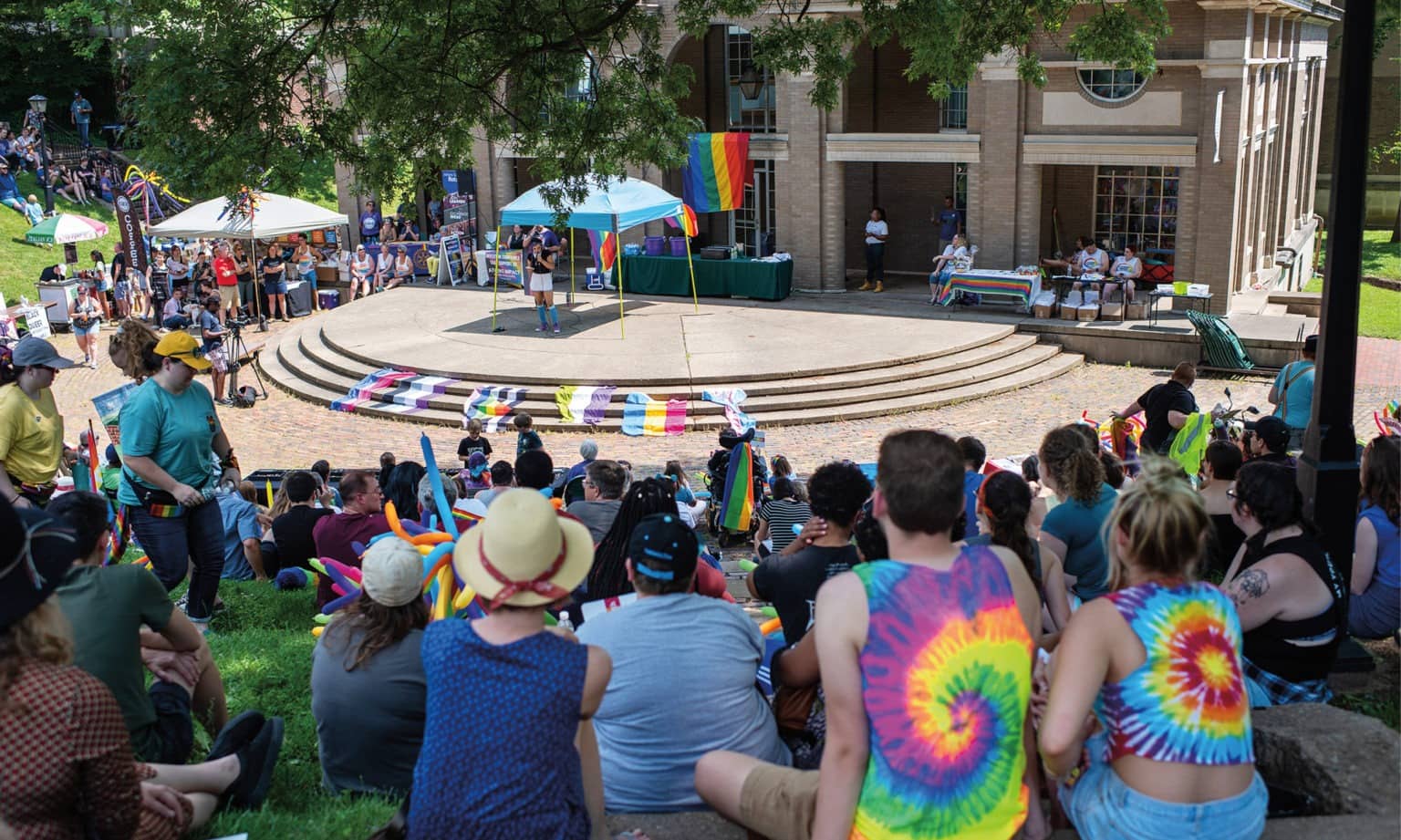 People sitting outside the Wilhelm Amphitheater during the 2019 Athens Pride Fest