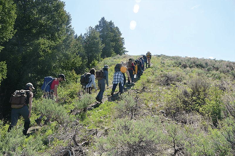 TSS faculty member Kevin Krasnow leads OHIO Fellows and Boyd Scholars on an educational, team-building hike up Lobo Hill near Kelly, Wyoming.