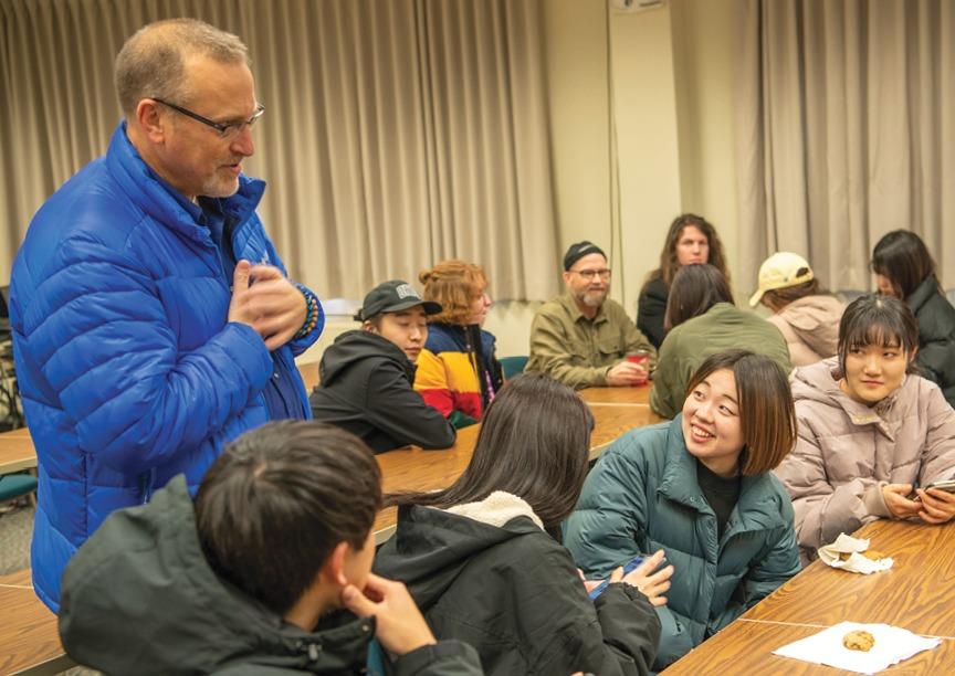 John Sabraw and Chris Thompson discuss a mural project in Japan with students from Chubu and Ohio University. Photo by Ben Wirtz Siegel, BSVC '02