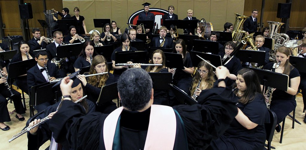 David Turrill directing the Muskingum Wind Ensemble during 2013 Commencement