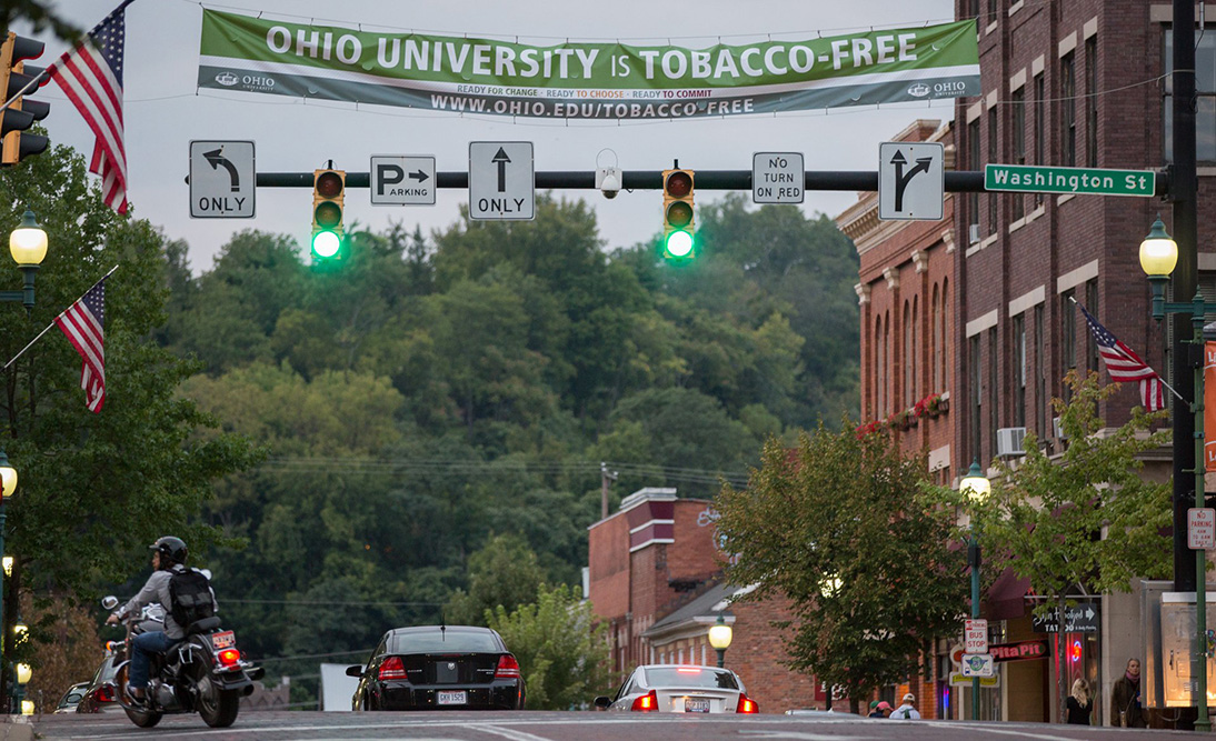 A banner signifying Ohio University as a tobacco-free campus hangs over Court Street in Athens, Ohio.