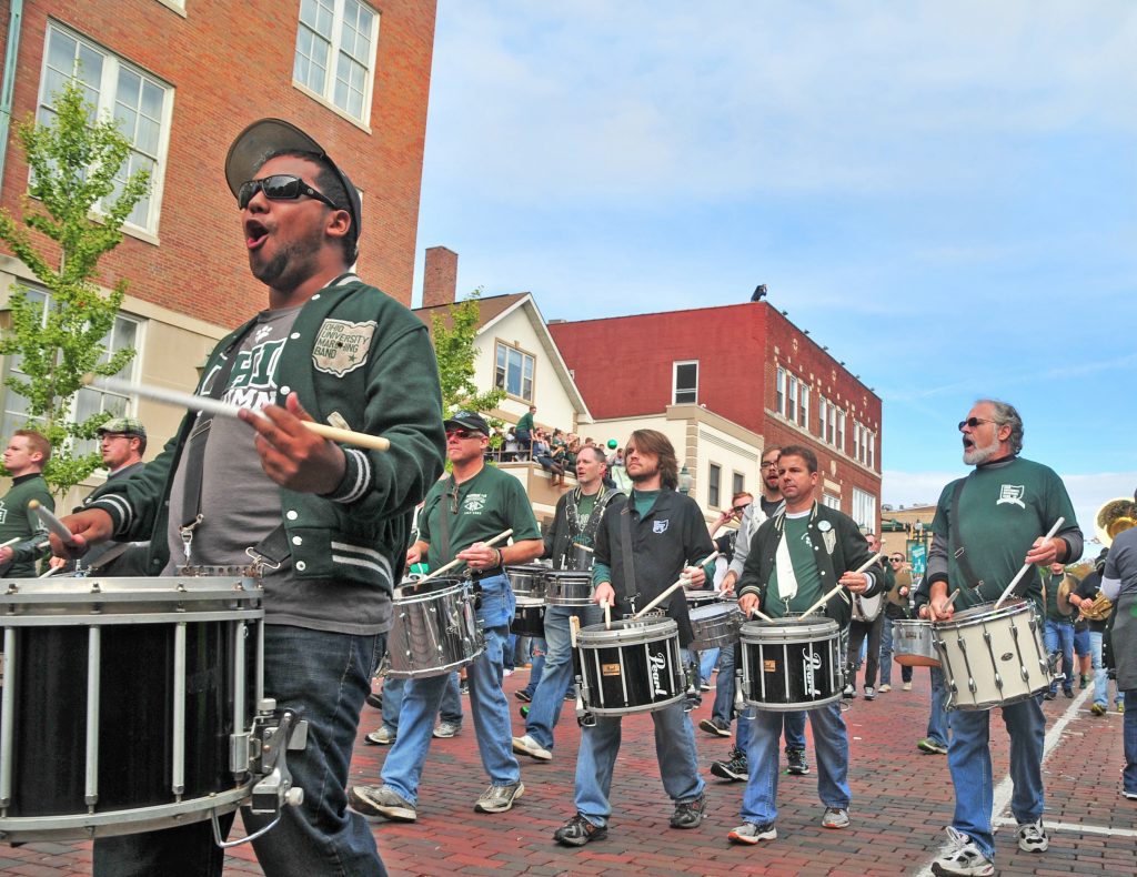 Each fall, more than 350 Ohio University Alumni Band members dust off their instruments and flags to strut their stuff at OHIO’s colorful and high-spirited Homecoming Parade.