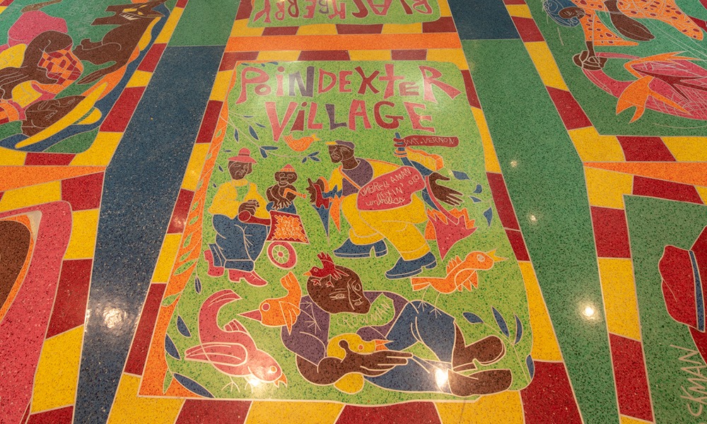 Embedded art into Baker Center's floor of a colorful depiction of the artist's childhood