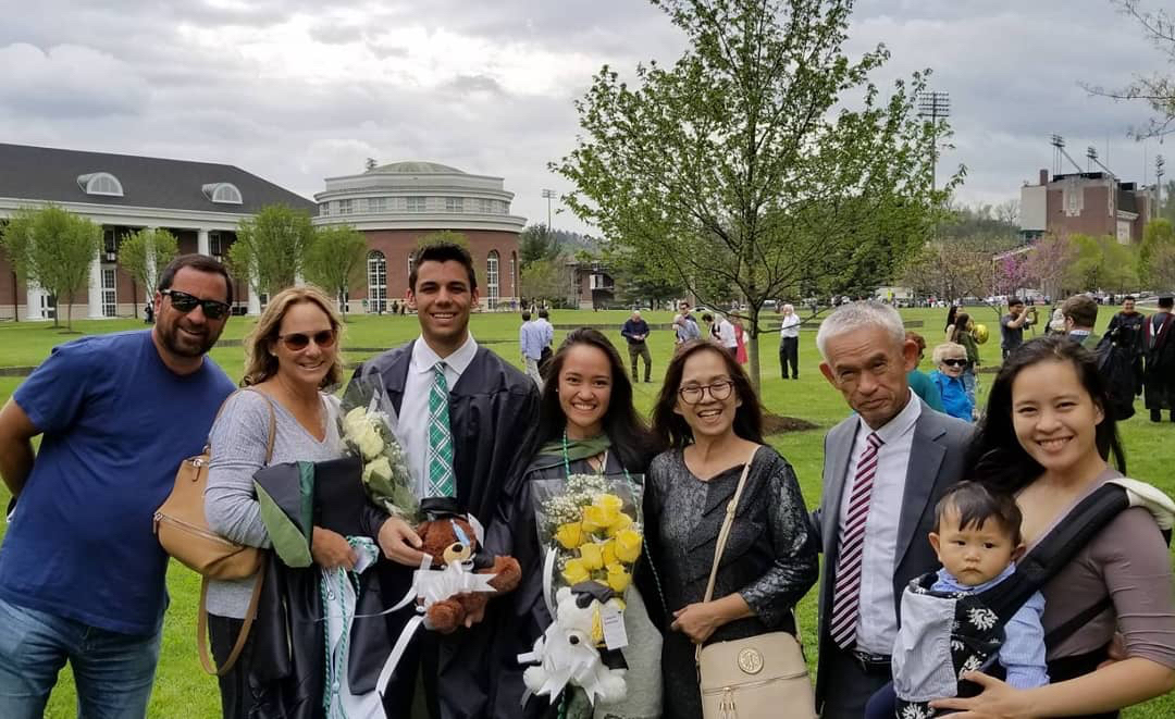 Pim (Thirati) Koondel, MBA ’17, MSA ’18, and Alec Koondel, MBA ’17, MSA ’18, celebrate their Ohio University graduation with their families.