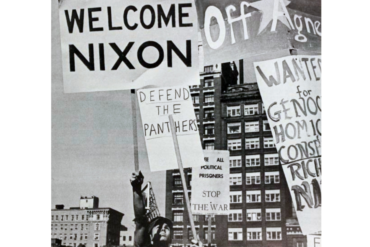 Welcome Nixon banner flies over a building