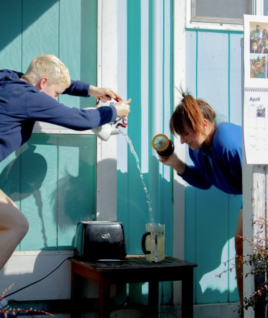 Dancers pouring tea